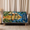 Book Stack Manor sherpa blanket hung over a sofa in a bright living room