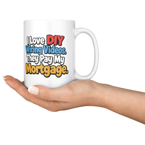 I Love DIY Wiring Videos. They Pay My Mortgage. 15oz electrician mug, held in an open hand 15 oz white ceramic electrician mug printed with "I Love DIY Wiring Videos. They Pay My Mortgage.", held in an open hand