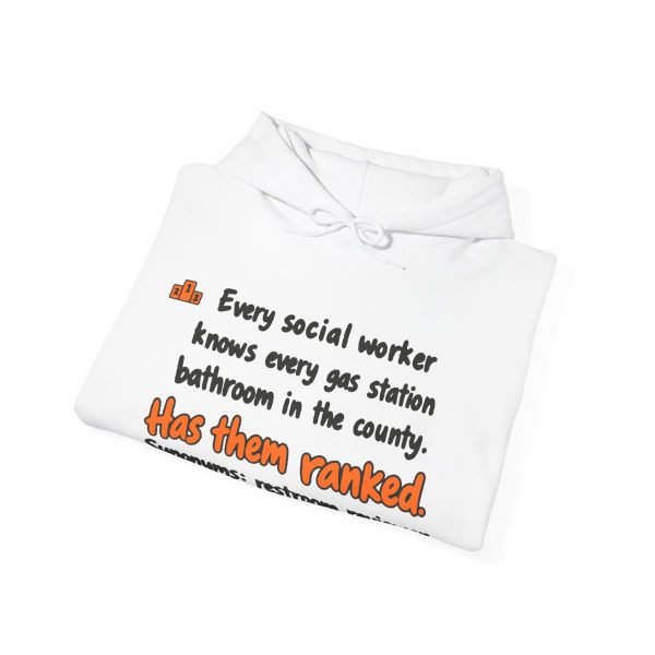 White hand-drawn hoodie with the social work gas station bathroom ranking joke, folded view