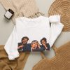 White crewneck sweatshirt printed with "The CEO Clicked the Phishing Link. We Called It Executive Training.", styled flat lay