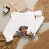 White crewneck sweatshirt printed with "I don't fix problems. I fix whatever the last guy called “temporary.” On the front of a white crewneck sweatshirt, with the smug tech and his duct-taped pipes. For maintenance staff who have met the last guy's work. Permanent repairs only.", styled flat lay