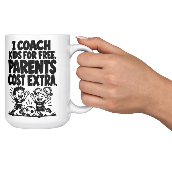 I COACH KIDS FOR FREE. PARENTS COST EXTRA. 15oz coach mug, held out by the handle 15 oz white ceramic youth coach mug printed with "I COACH KIDS FOR FREE. PARENTS COST EXTRA.", held out by the handle