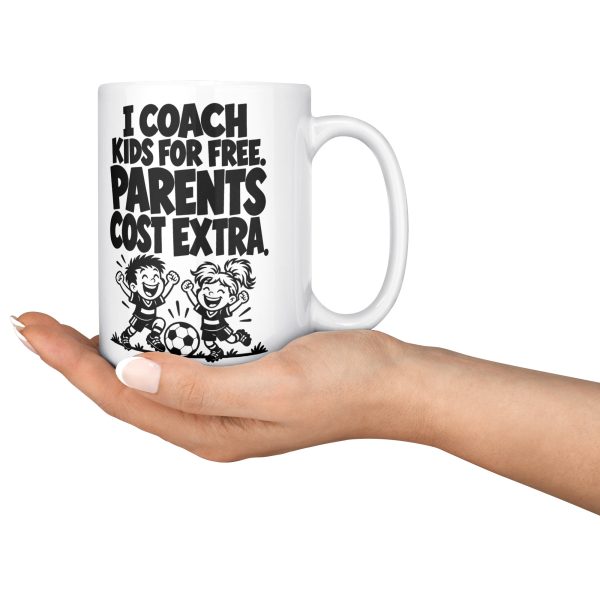 I COACH KIDS FOR FREE. PARENTS COST EXTRA. 15oz coach mug, held in an open hand 15 oz white ceramic youth coach mug printed with "I COACH KIDS FOR FREE. PARENTS COST EXTRA.", held in an open hand