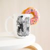 15 oz white ceramic plumber mug printed with "I DON'T PANIC AT FLOODS. I INVOICE THEM.", with a donut