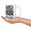 15 oz white ceramic plumber mug printed with "I DON'T PANIC AT FLOODS. I INVOICE THEM.", held in an open hand