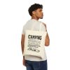 Natural tote bag printed with a black vintage CAMPING dictionary entry ending "a sleeping pad that was full of air at 10 p.m.", carried over the shoulder