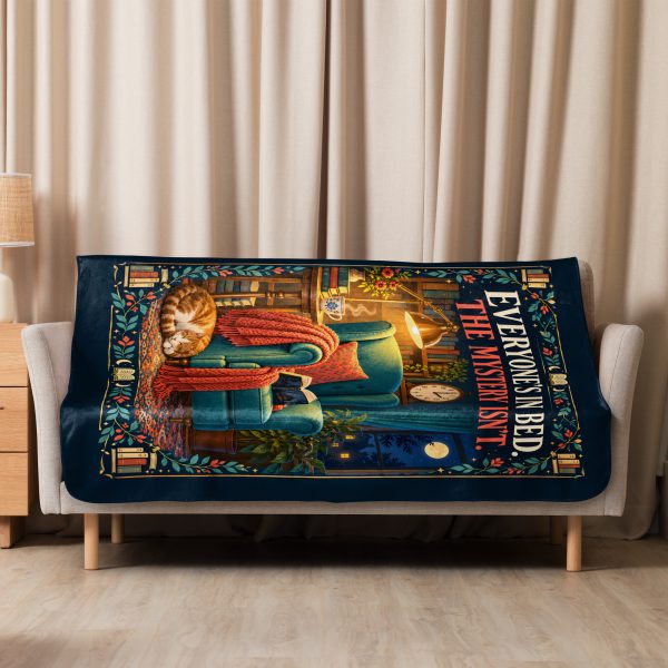 Midnight Mystery Reader sherpa blanket hung over a sofa in a bright living room Midnight Mystery Reader sherpa blanket hung over a sofa in a bright living room