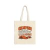 Natural tote bag printed with an orange and navy CAMPING dictionary entry ending "a sleeping pad that was full of air at 10 p.m."