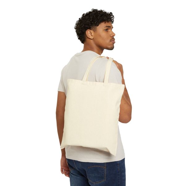 Plain tote bag, back view, carried over the shoulder