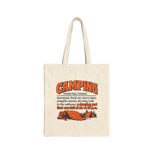 Natural tote bag printed with an orange and navy CAMPING dictionary entry ending "a sleeping pad that was full of air at 10 p.m."
