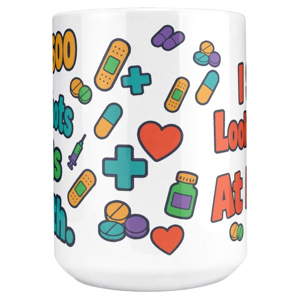 Gave 600 flu shots, still look away, and your team know 15oz mug, front view of the wrap 15 oz white ceramic pharmacist mug, "Gave 600 flu shots this month" on one side and "I still look away at mine" on the other, with pills, bandages and syringes, front view of the wrap