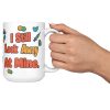 Gave 600 flu shots, still look away, and your team know 15oz mug, raised in hand 15 oz white ceramic pharmacist mug, "Gave 600 flu shots this month" on one side and "I still look away at mine" on the other, with pills, bandages and syringes, raised in hand