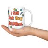 Gave 600 flu shots, still look away, and your team know 15oz mug, held in an open hand 15 oz white ceramic pharmacist mug, "Gave 600 flu shots this month" on one side and "I still look away at mine" on the other, with pills, bandages and syringes, held in an open hand