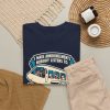 i-make-announcements-nobody-listens-to-a-pilot-t-shirt-4 Navy T-shirt printed with "I Make Announcements Nobody Listens To. Then I Land the Plane Anyway.", styled flat lay