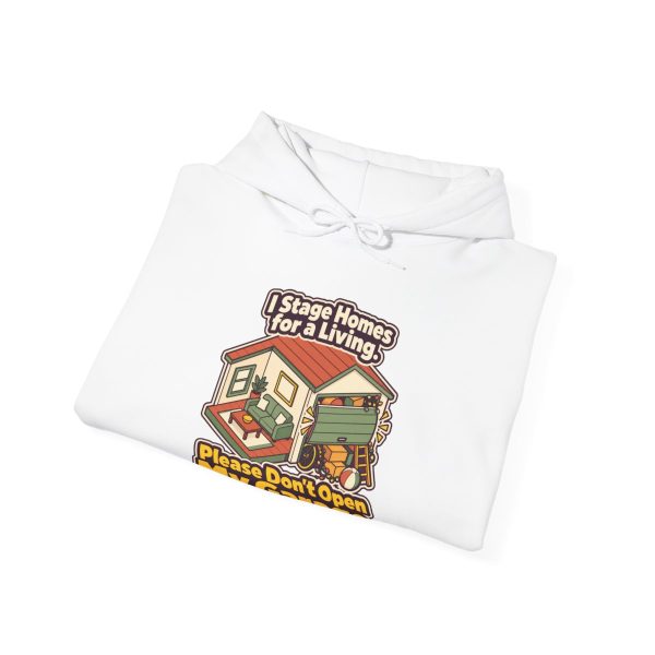 home-stager-hoodie-i-stage-homes-for-a-living-please-dont-op-4 White hoodie printed with "I Stage Homes for a Living. Please Don't Open My Garage.", folded view