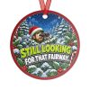 STILL LOOKING FOR THAT FAIRWAY. round metal Christmas ornament, back view