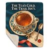 Tea and Books sherpa blanket laid flat with one corner folded back to show the soft cream sherpa reverse
