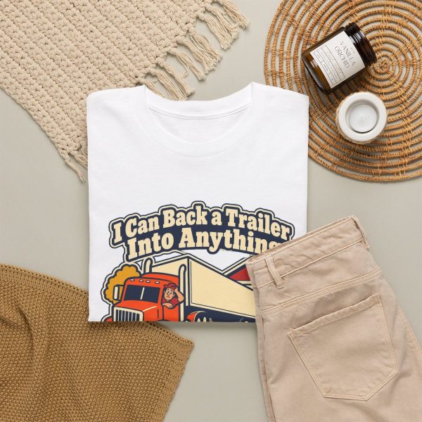 trucker-t-shirt-i-can-back-a-trailer-into-anything-except-my-4 White T-shirt printed with "I Can Back a Trailer Into Anything Except My Own Driveway.", styled flat lay
