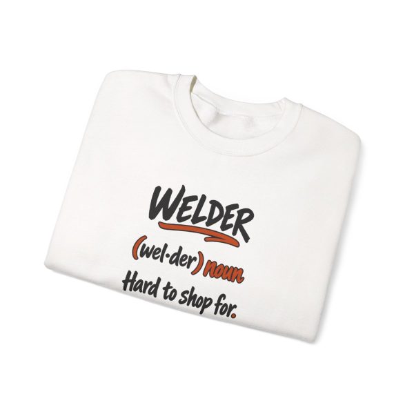 White hand-drawn crewneck sweatshirt with the welder dictionary joke: Hard to shop for. Already built it., folded view