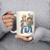 15 oz white ceramic electrician mug printed with "I Love DIY Wiring Videos. They Pay My Mortgage.", held at chest