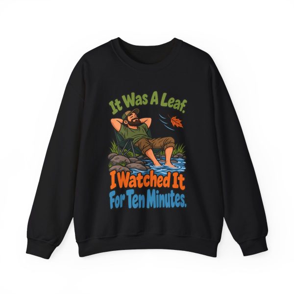 Watched a leaf for ten minutes and your bird club knows it. Sketch crewneck Black hand-drawn crewneck sweatshirt with the birder joke: It was a leaf. I watched it for ten minutes.