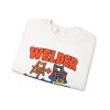 White crewneck sweatshirt printed with an orange and blue WELDER dictionary entry, "Hand them a $5 chair. It comes back weighing 90 pounds.", folded view