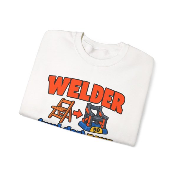 White crewneck sweatshirt printed with an orange and blue WELDER dictionary entry, "Hand them a $5 chair. It comes back weighing 90 pounds.", folded view