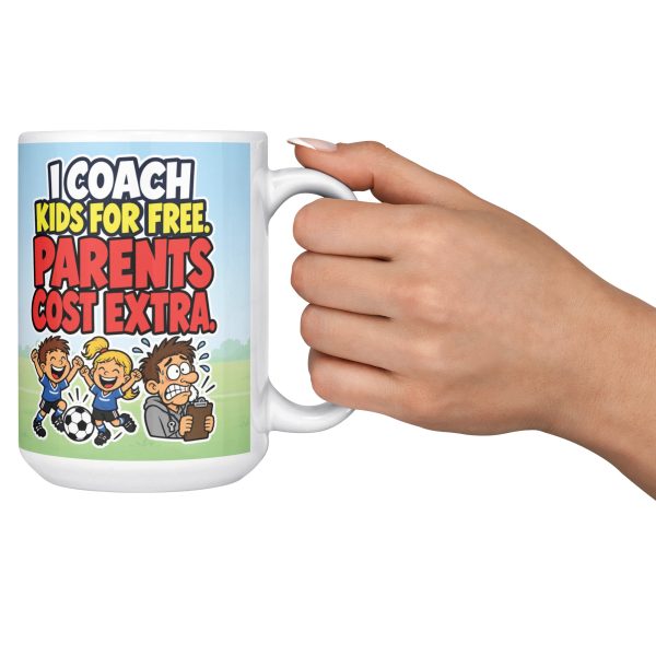 I COACH KIDS FOR FREE. PARENTS COST EXTRA. 15oz coach mug, held out by the handle 15 oz white ceramic youth coach mug printed with "I COACH KIDS FOR FREE. PARENTS COST EXTRA.", held out by the handle